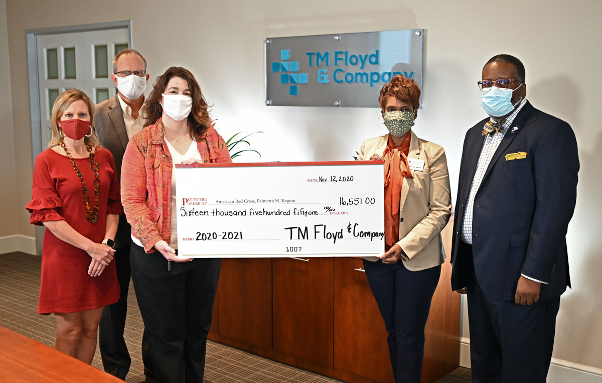 TM Floyd employees presenting a check to the American Red Cross