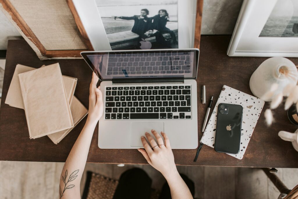 person sitting at desk on laptop